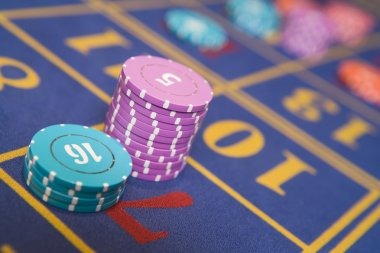 Live-dealer baccarat table with dealer